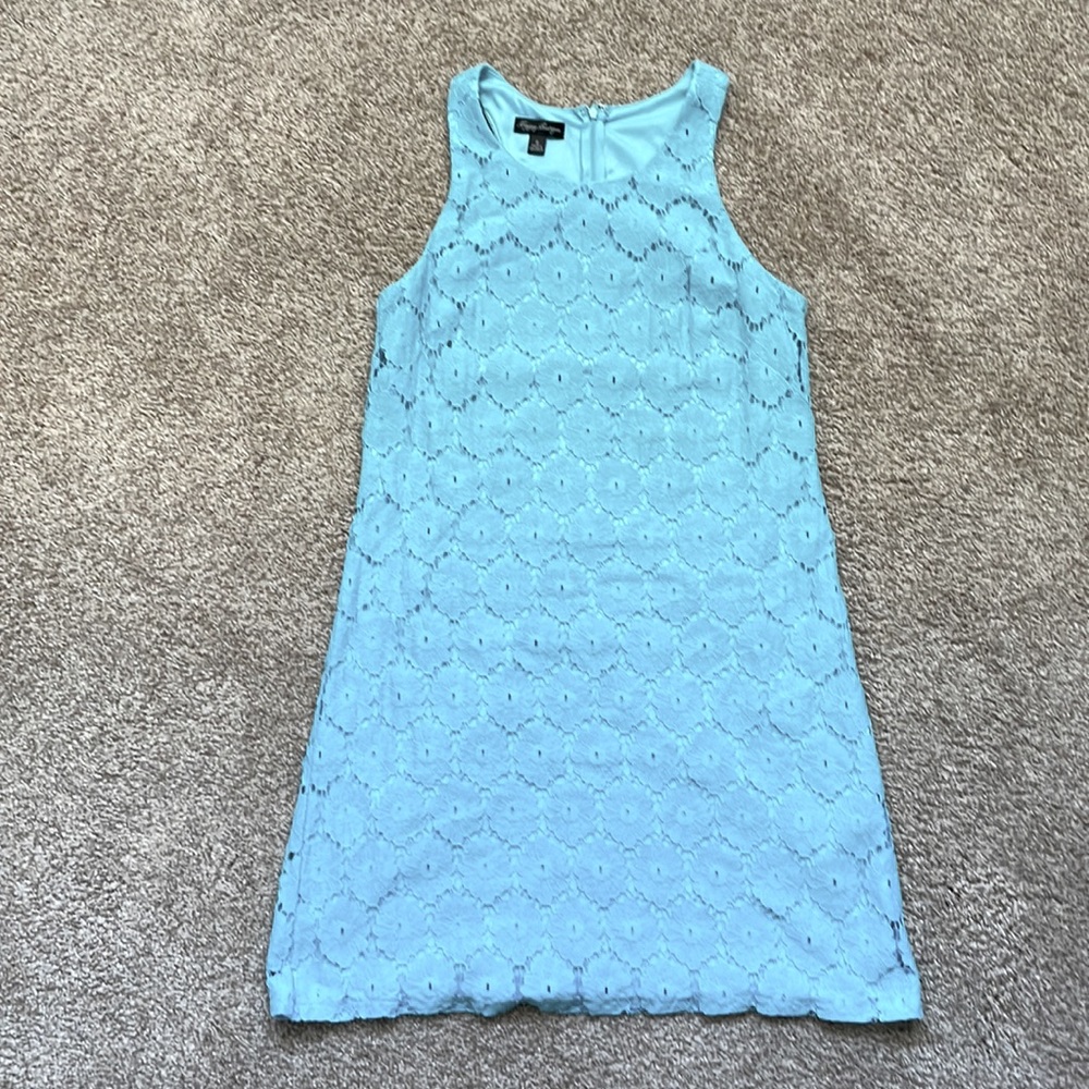 Light blue sleeveless dress.
